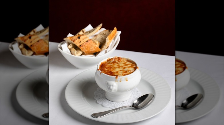 French onion soup with a bread basket