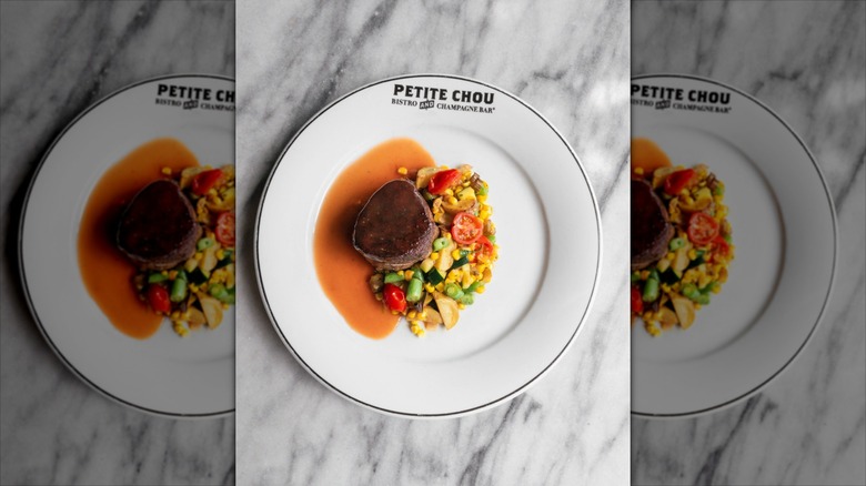 Filet mignon with vegetable medley on white Petite Chou plate