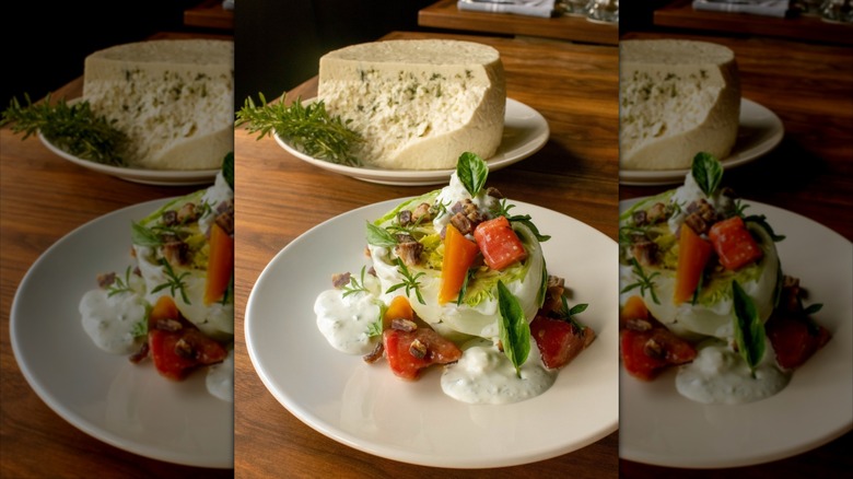 Cheese in background, creamy cheese and vegetables in foreground