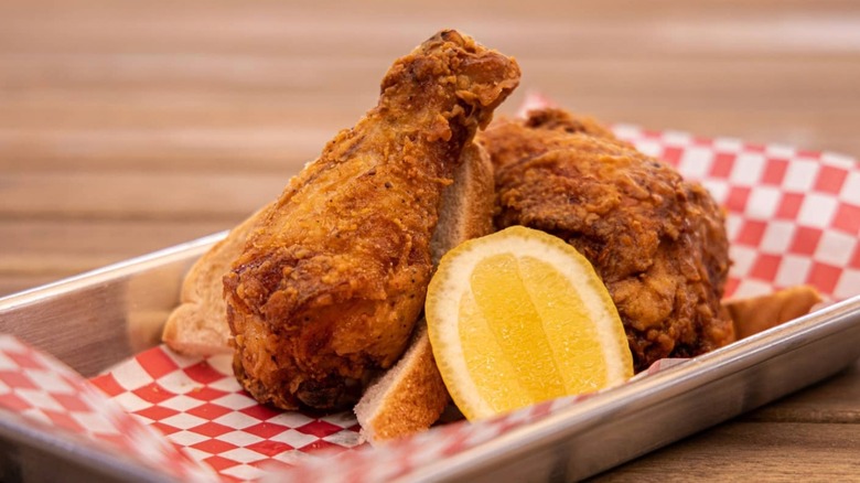 BirdHouse fried chicken basket with a fresh sliced lemon wedge