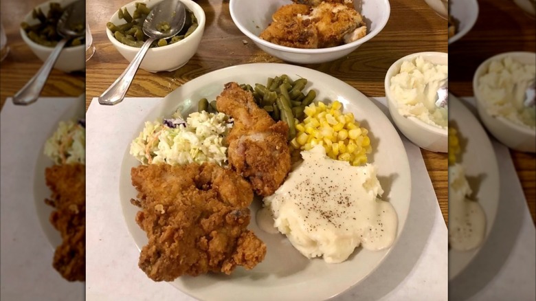 Monte Ne Inn Chicken friend chicken plate with assorted sides of mashed potatoes and gravy, green beans and corn