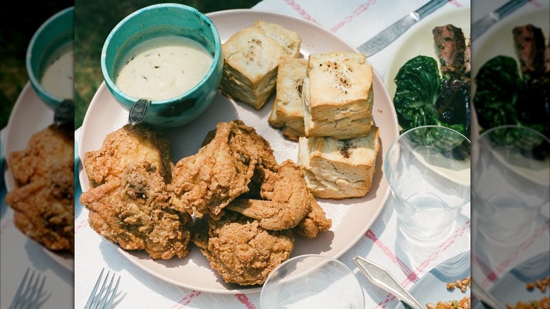 Nan's Kitchen fried chicken plate with biscuits and gravy on picnic setup