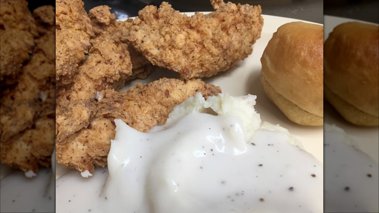 Southern Belle Restaurant fried chicken with sides of biscuit and mashed potatoes with gravy