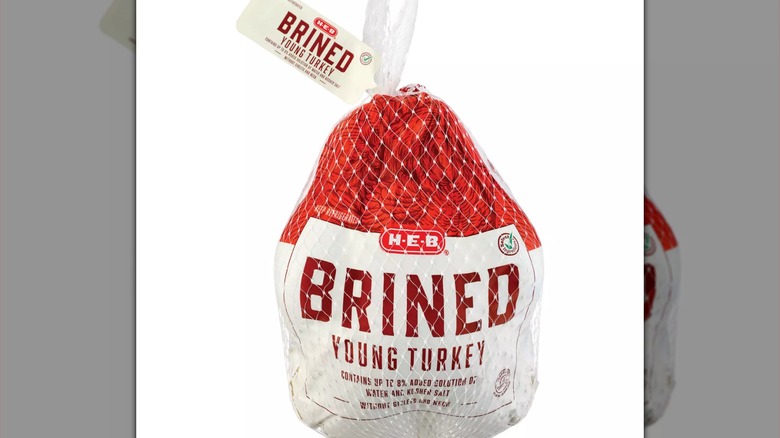 H-E-B sign with shopping cart silhouette