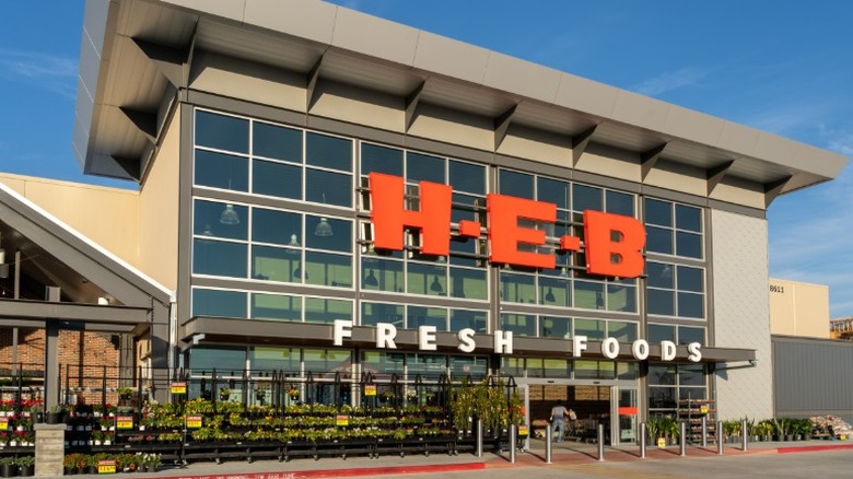 H-E-B Fresh Foods storefront with plants outside store