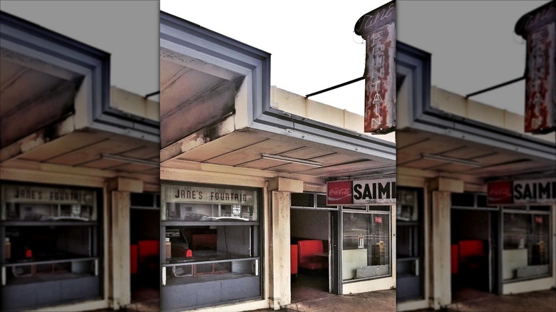 Jane's Fountain restaurant exterior with an old sign
