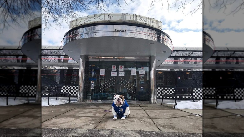Exterior of Drake Diner with bulldog mascot in front