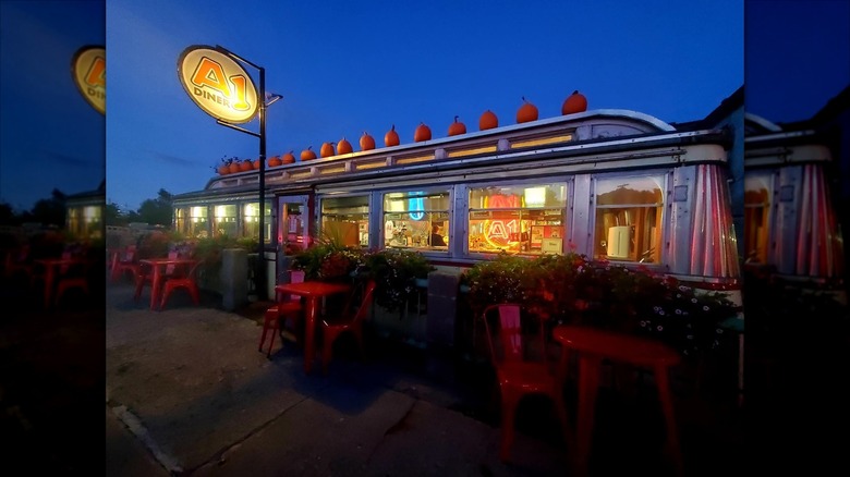 Exterior A1 Diner at night with neon signage lit up