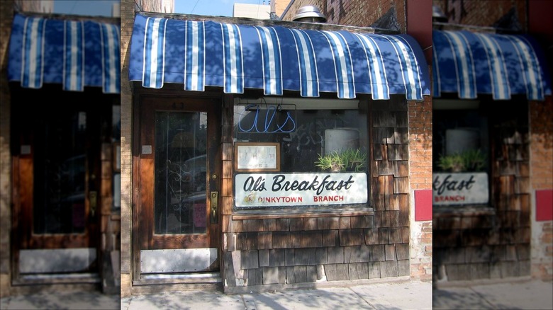 Al's Breakfast exterior with blue and white striped awning