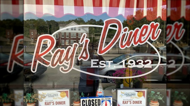 Ray's Diner exterior showing a window with the diner name on