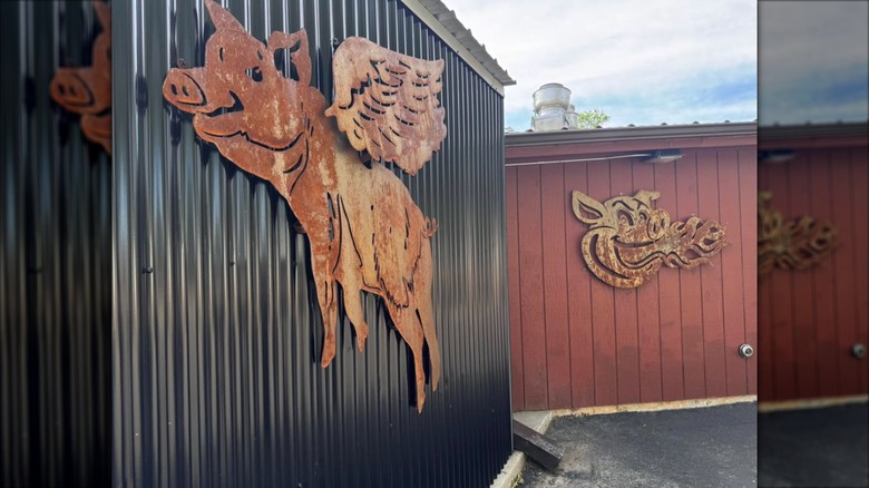 Exterior of Roadhouse Diner showing a sign of a pig with wings