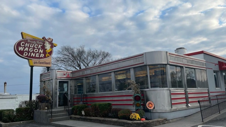 Chris' Chuck Wagon Diner exterior with a sign with a cowboy on