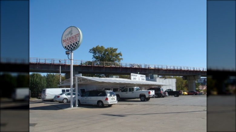 Original Market Diner exterior with a big sign and cars outside