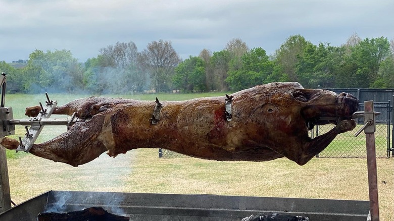 Meat roasting over a pit from Kosmos Greekafe