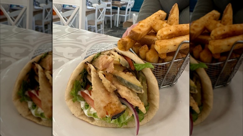Gyro with basket of French fries on a white plate at YiaYia's Greek Kitchen