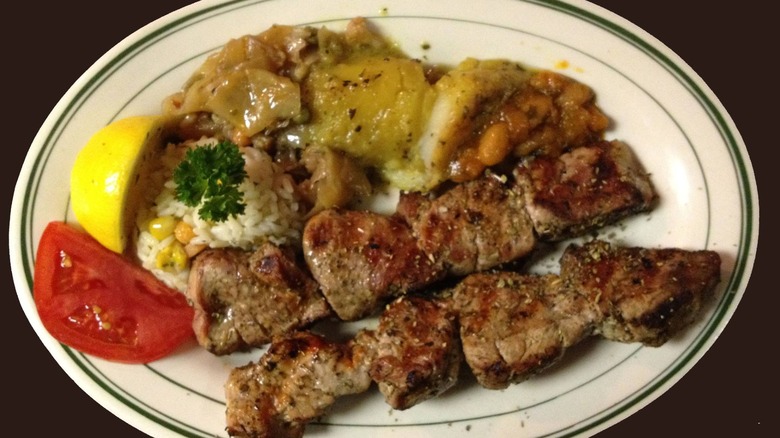 Grilled meat plate with rice and tomatoes from Zorba's Tavern