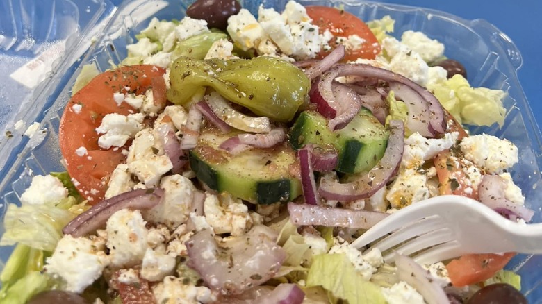 Greek salad from Yanni's Greek Express in a plastic to-go container