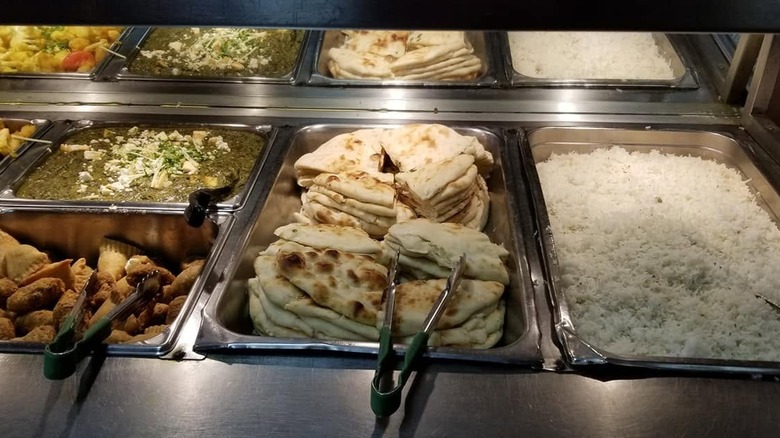 A buffet spread with naan and rice at Madhuban Indian Cuisine