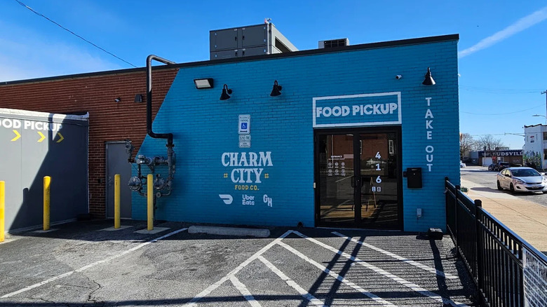 The literal hole-in-the-wall for picking up food at Unavu in Baltimore