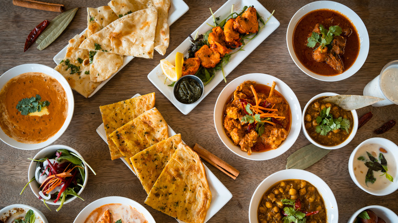 A tabletop view of a selection of Indian dishes
