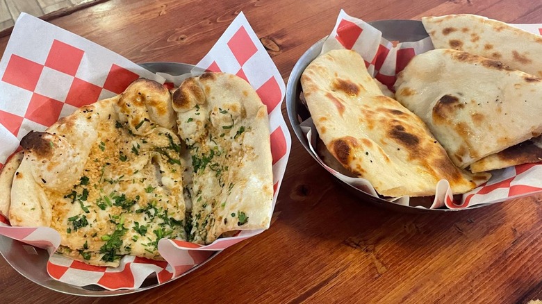 A variety of naan bread in two separate bowls from Taste of India