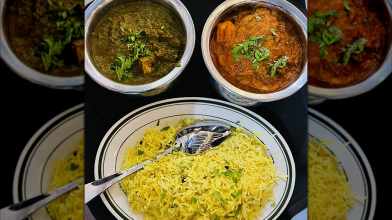 Curries and rice from Namaste Garden in metal bowls