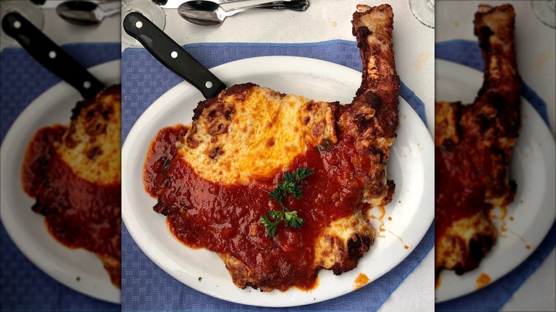 Veal chop parmesan on a plate