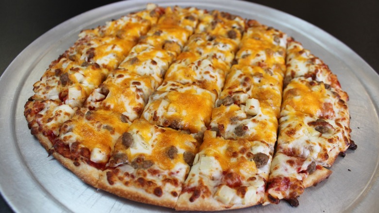 Whole cheese with sausage pizza from Nick's Pizza