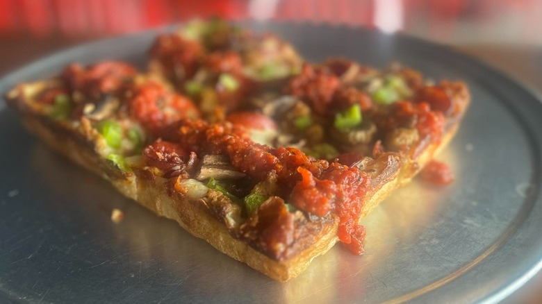 Thin square Detroit-style pizza with fresh veggies and tomato sauce from Motor City Pizza