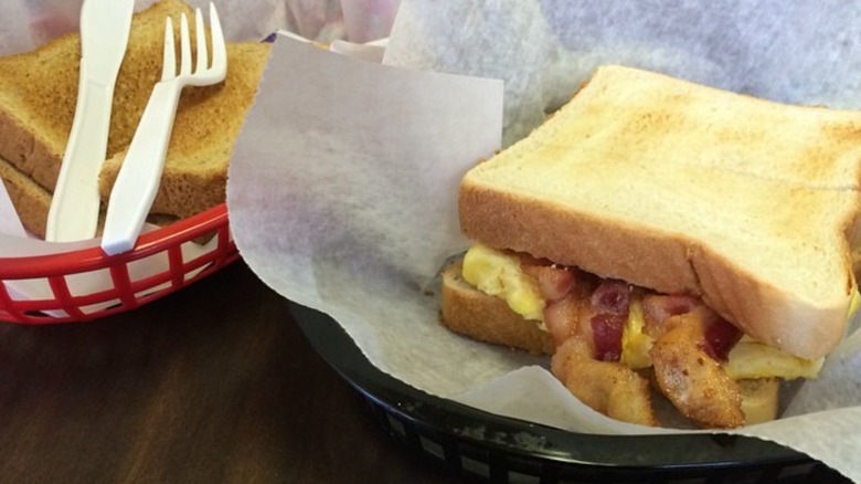 Crofton Depot Carryout bacon and egg sandwich alongside one more sandwich