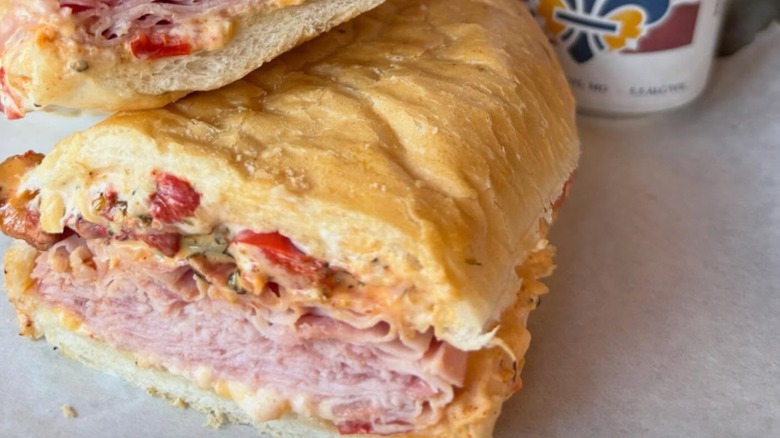 The Blues City Wide Po-boy with hot ham, bacon, CITY WIDE pimento cheese spread, pickles, grilled bell peppers, and boom boom sauce on a toasted hoagie, brushed with garlic oil from Blues City Deli