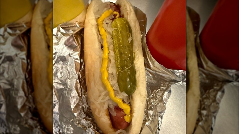 hot dog with onions and pickle from J. Dawgs