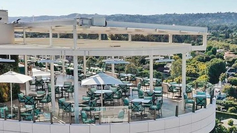 An aerial shot of the rooftop restaurant with the Hollywood hills in the distance