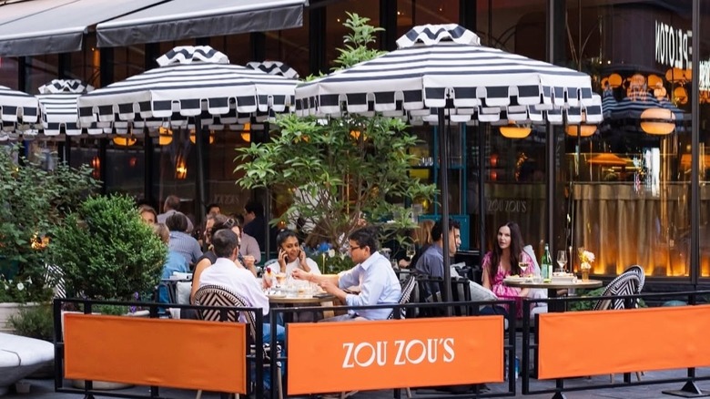 Diner eat outdoors at the patio at zouzou