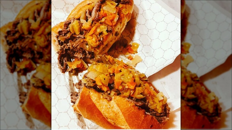 Half of an Italian beef sandwich, resting on wrapping paper.