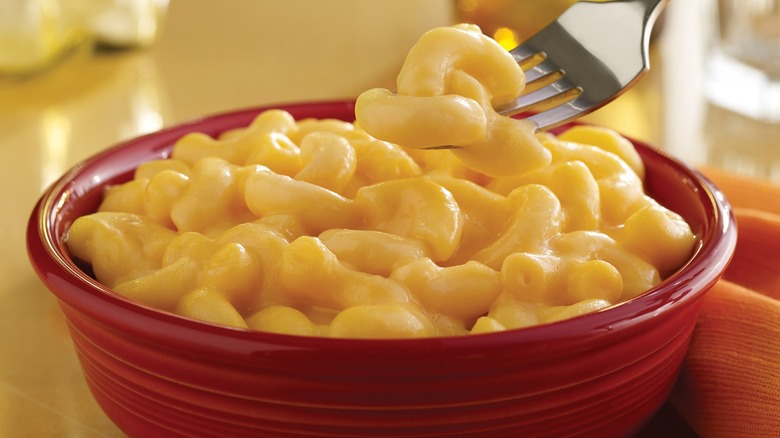 Red ceramic bowl filled with Golden Corral Mac and Cheese