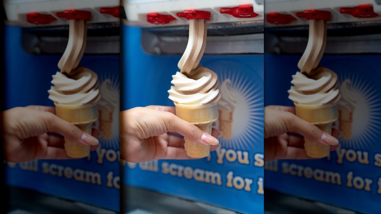 Golden Corral Soft Serve Machine outputting a soft serve cone with hand holding it