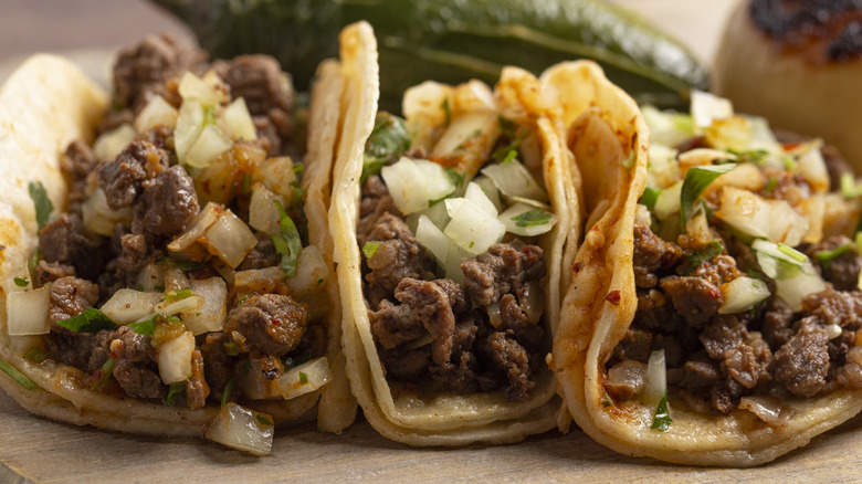 Steak street tacos on corn tortillas with onions and cilantro
