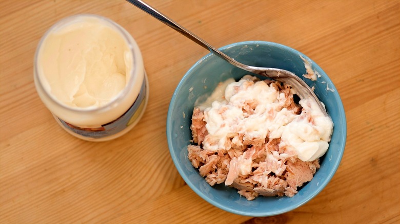 Jar of mayo next to bowl of canned tuna and mayo