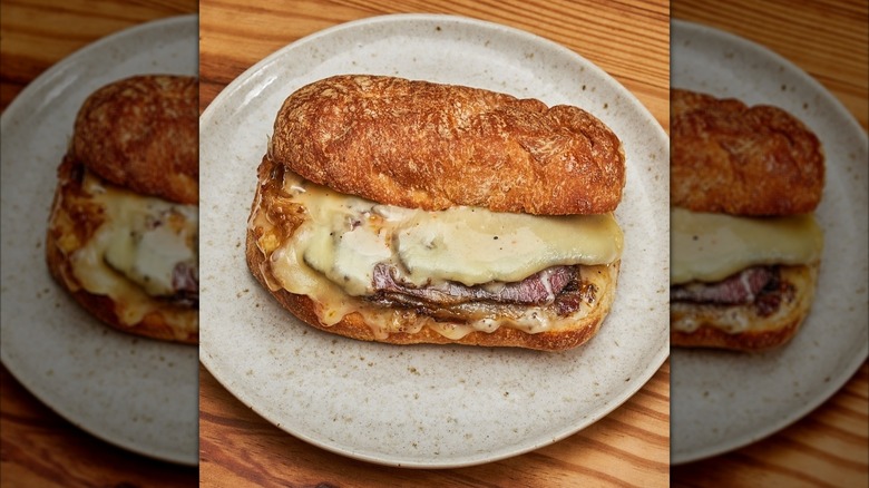 Krüs Kitchen cheesy pastrami sandwich on plate