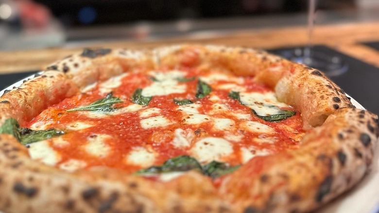 Close up of pizza topped with basil