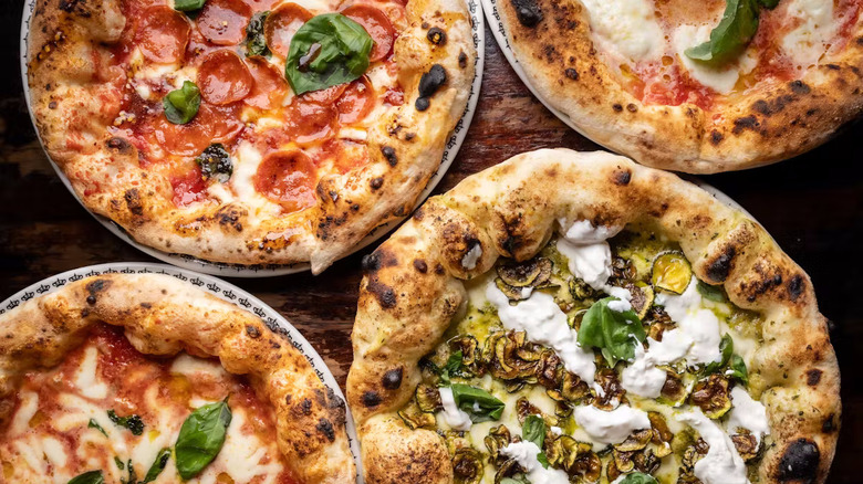 Close up of pepperoni and other pizzas