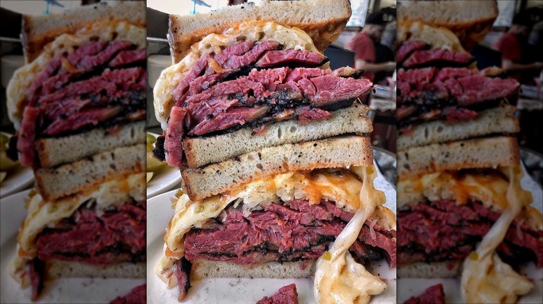 Double decker pastrami Reuben cut in half