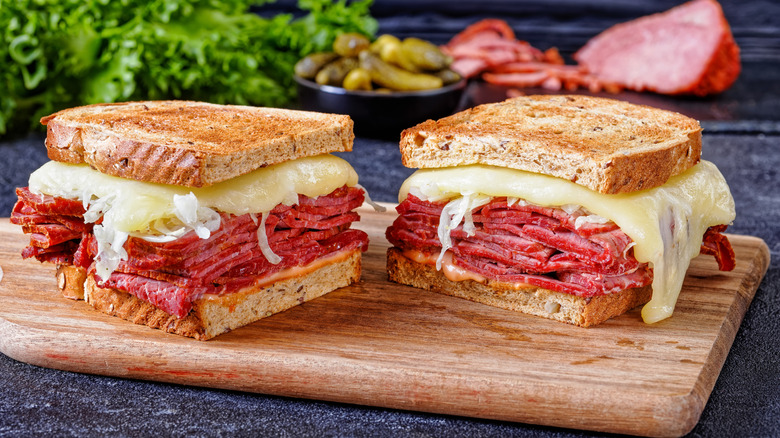 A Reuben sandwich on cutting board