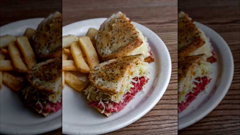 Reuben sandwich with fries on plate