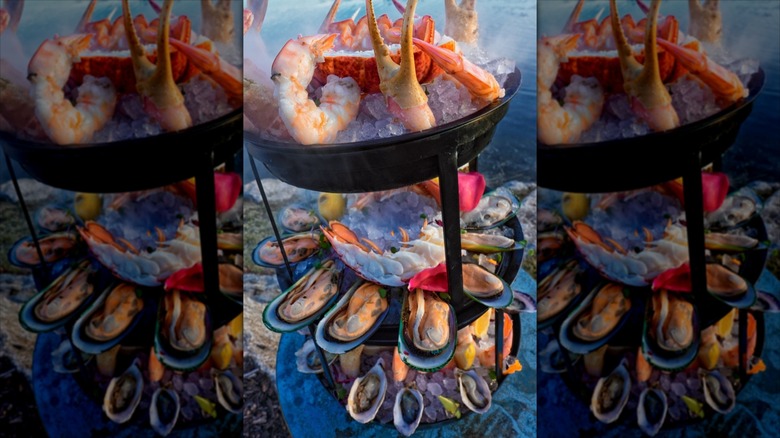 Seafood tower with mussels, lobsters, and shrimp