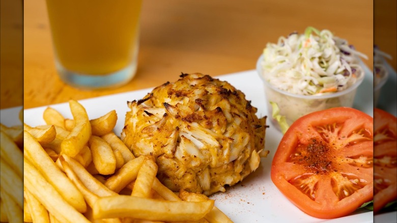 Lump of crab cake with fries and coleslaw