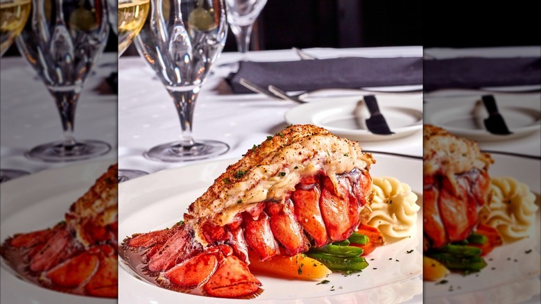 Whole lobster on a bed of vegetables