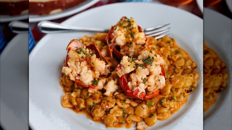 Crab served in crab shells on top of pasta