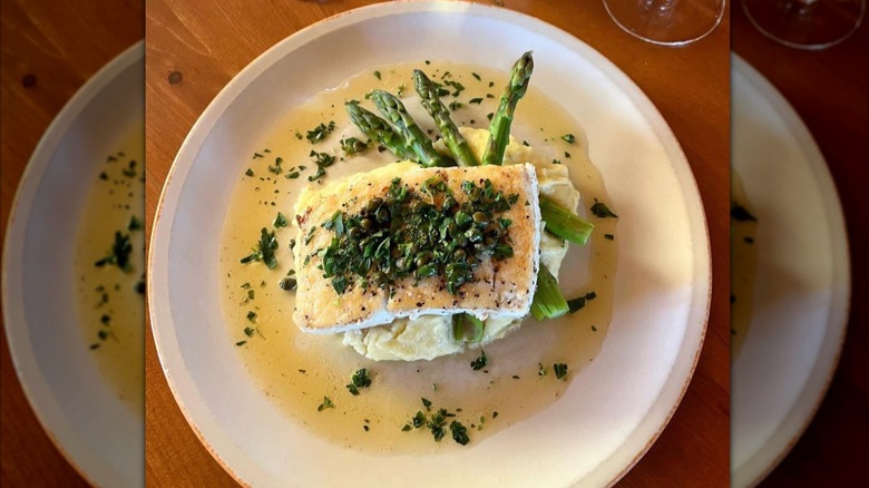 Plate of white fish with asparagus
